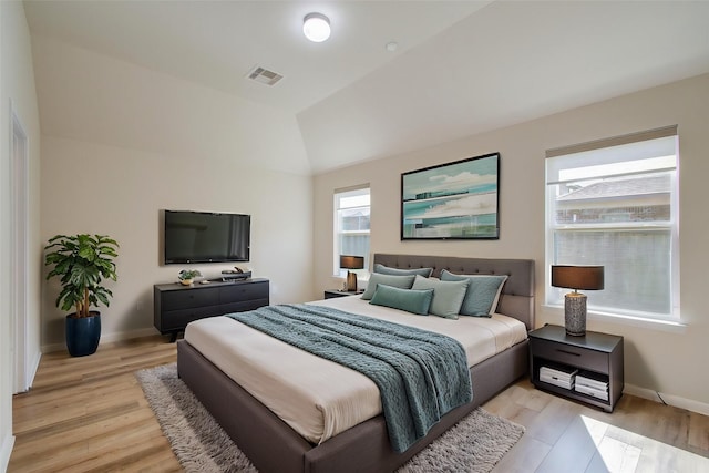 20615 Footstep Path, Katy, TX 77449 - bedroom with light wood-style flooring, vaulted ceiling, and baseboards