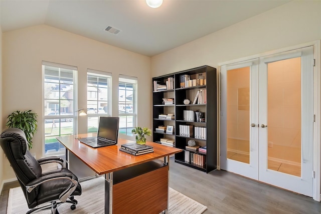 20615 Footstep Path, Katy, TX 77449 - office area featuring light wood-style floors, french doors, and vaulted ceiling