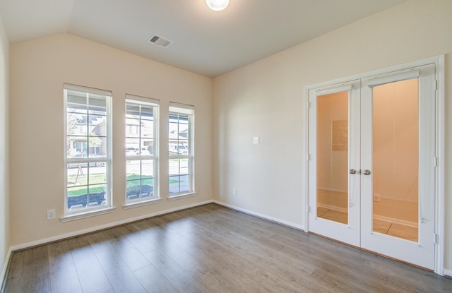 20615 Footstep Path, Katy, TX 77449 - unfurnished room featuring french doors, wood finished floors, lofted ceiling, and baseboards