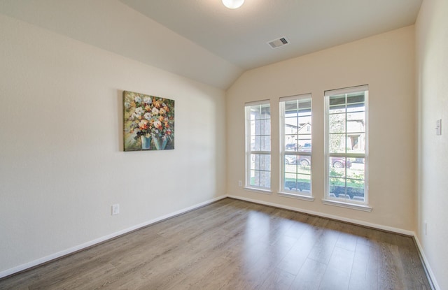 20615 Footstep Path, Katy, TX 77449 - spare room with wood finished floors, baseboards, and vaulted ceiling