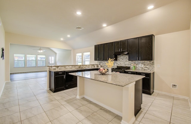 20615 Footstep Path, Katy, TX 77449 - kitchen featuring tasteful backsplash, stove, dishwasher, a peninsula, and light tile patterned flooring
