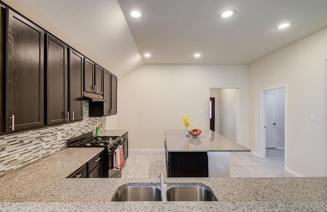 20615 Footstep Path, Katy, TX 77449 - kitchen with gas stove, a sink, decorative backsplash, light stone countertops, and light tile patterned floors