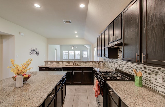20615 Footstep Path, Katy, TX 77449 - kitchen featuring black range with gas cooktop, a sink, under cabinet range hood, backsplash, and light stone counters