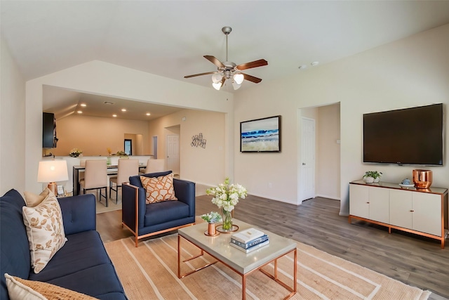 20615 Footstep Path, Katy, TX 77449 - living area with wood finished floors, a ceiling fan, lofted ceiling, recessed lighting, and baseboards