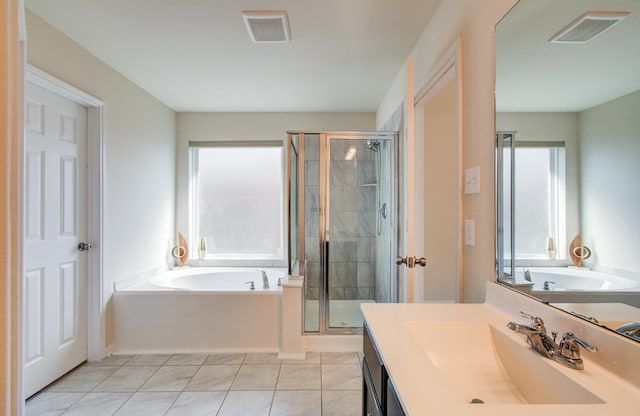 20615 Footstep Path, Katy, TX 77449 - bathroom featuring a shower stall, a garden tub, tile patterned flooring, and vanity
