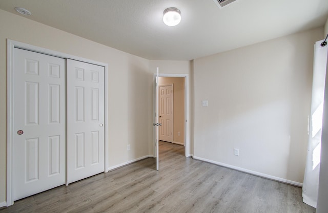 20615 Footstep Path, Katy, TX 77449 - unfurnished bedroom with wood finished floors, baseboards, and a closet
