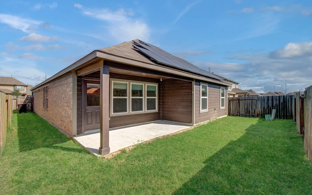 20615 Footstep Path, Katy, TX 77449 - back of house featuring solar panels and a patio