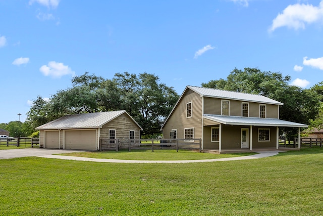 13415 Bayonne Cir, Tomball, TX 77377 - view of front of home featuring a garage, metal roof, and an outbuilding