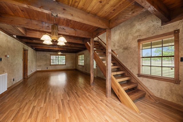 13415 Bayonne Cir, Tomball, TX 77377 - stairway featuring wood finished floors, a chandelier, baseboards, and wood ceiling with exposed beams