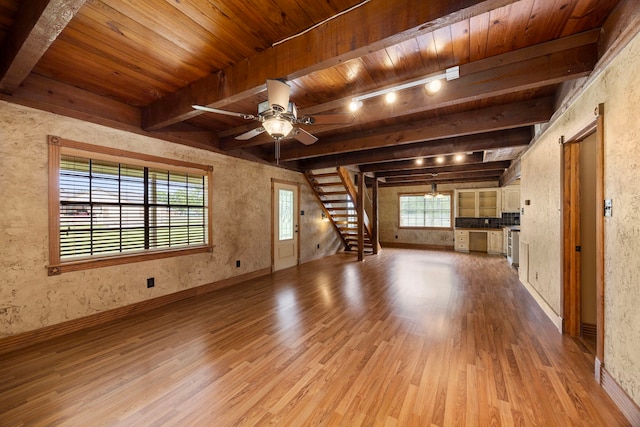 13415 Bayonne Cir, Tomball, TX 77377 - unfurnished living room with light wood-style flooring, wooden ceiling with exposed beams, stairway, ceiling fan, and baseboards