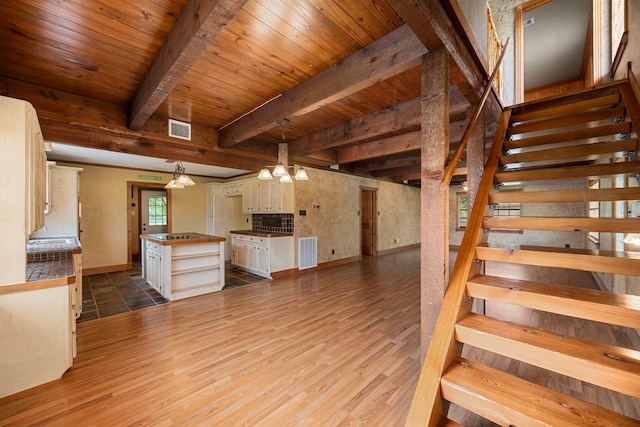 13415 Bayonne Cir, Tomball, TX 77377 - kitchen featuring dark wood-style floors, wood ceiling with exposed beams, open shelves, a chandelier, and baseboards