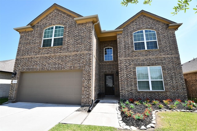 traditional home with brick siding, concrete driveway, and a garage