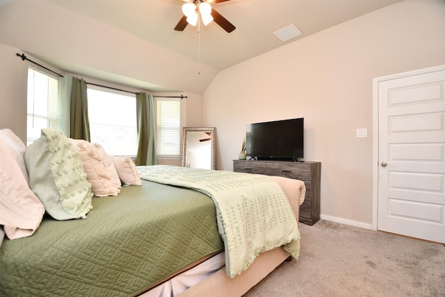 bedroom featuring carpet flooring, lofted ceiling, baseboards, and ceiling fan