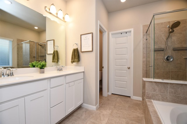 full bathroom with a shower stall, double vanity, recessed lighting, tiled bath, and tile patterned floors