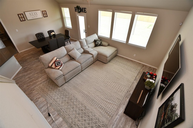 living room featuring wood finished floors and baseboards
