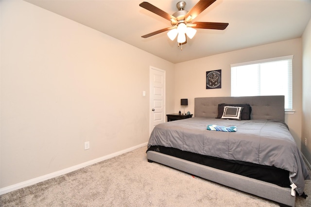 bedroom featuring carpet, baseboards, and a ceiling fan
