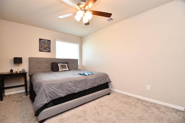 bedroom with carpet floors, baseboards, and a ceiling fan