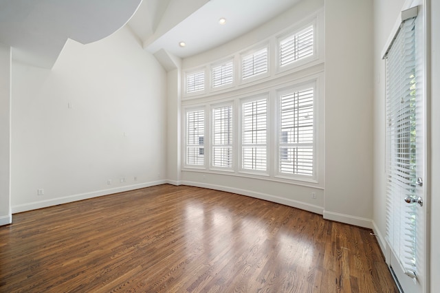 2909 Pease St, Houston, TX 77003 - unfurnished room featuring baseboards, dark wood-type flooring, high vaulted ceiling, and recessed lighting