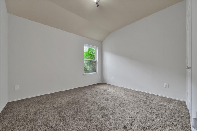 2526 Wood Park Blvd, Conroe, TX 77304 - spare room featuring lofted ceiling, carpet, and baseboards