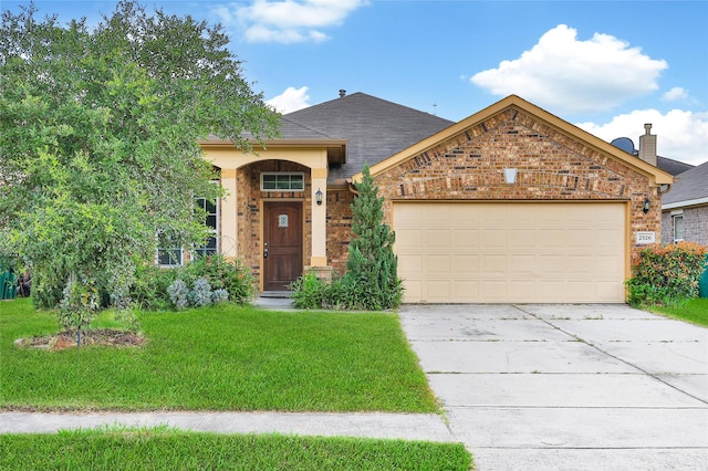 2526 Wood Park Blvd, Conroe, TX 77304 - view of front of house featuring a front yard, driveway, an attached garage, and brick siding
