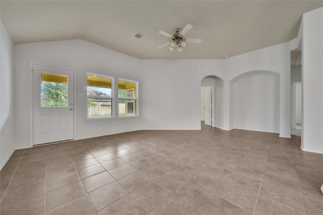 2526 Wood Park Blvd, Conroe, TX 77304 - tiled spare room featuring arched walkways, ceiling fan, and lofted ceiling