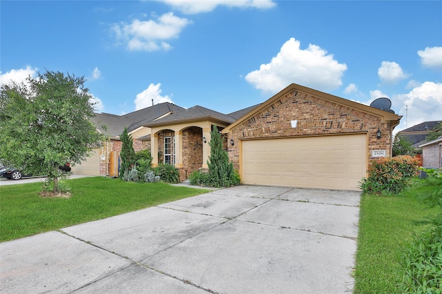 2526 Wood Park Blvd, Conroe, TX 77304 - ranch-style house featuring driveway, a front lawn, a garage, and brick siding