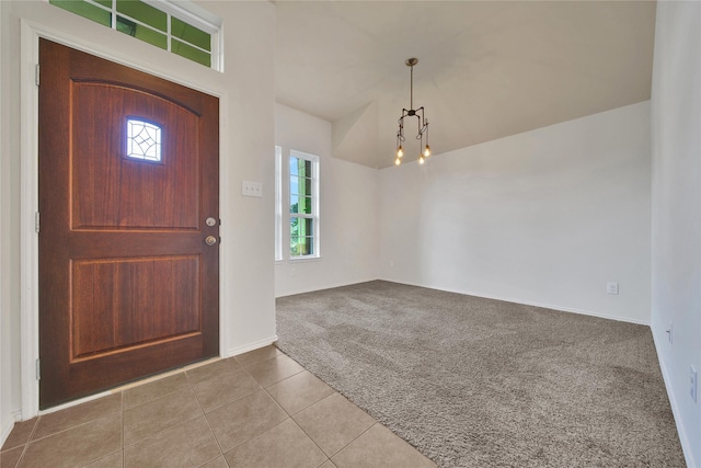2526 Wood Park Blvd, Conroe, TX 77304 - tiled entryway featuring carpet floors, healthy amount of natural light, a chandelier, and baseboards