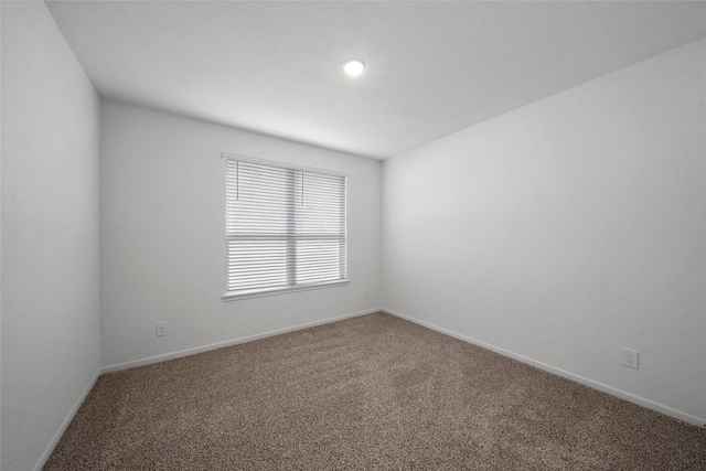 177 Jim Hall Ln, New Waverly, TX 77358 - spare room featuring carpet floors and baseboards