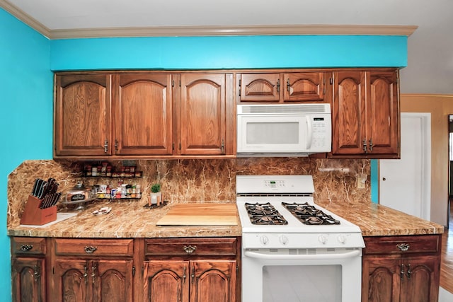 14518 Littleford St, Houston, TX 77045 - kitchen with white appliances, backsplash, light countertops, and ornamental molding