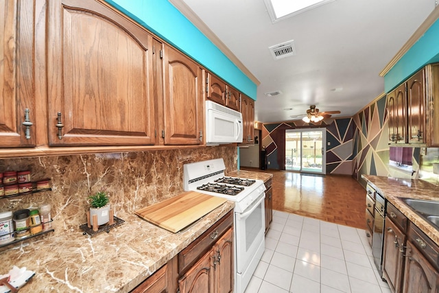 14518 Littleford St, Houston, TX 77045 - kitchen with white appliances, tasteful backsplash, ceiling fan, open floor plan, and ornamental molding