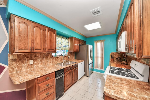 14518 Littleford St, Houston, TX 77045 - kitchen featuring a sink, white appliances, backsplash, light countertops, and light tile patterned floors