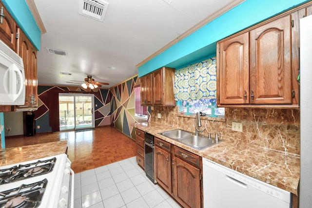 14518 Littleford St, Houston, TX 77045 - kitchen with white appliances, a sink, ceiling fan, tasteful backsplash, and light countertops