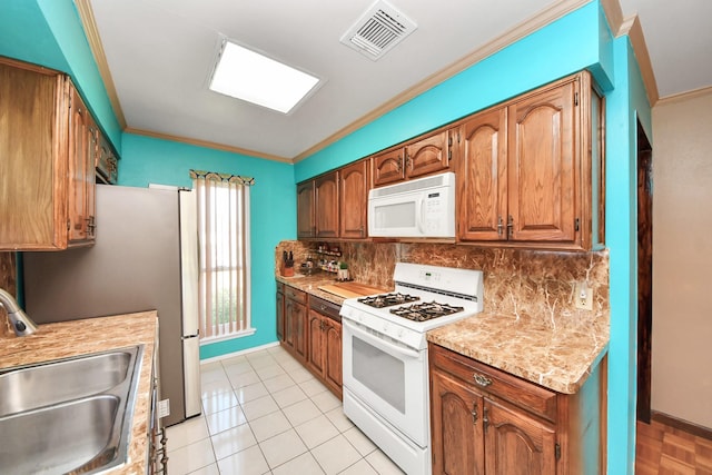 14518 Littleford St, Houston, TX 77045 - kitchen with white appliances, ornamental molding, a sink, light countertops, and tasteful backsplash