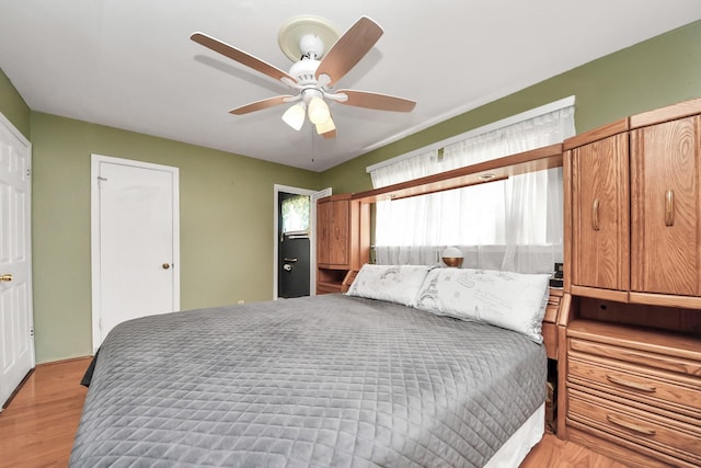 14518 Littleford St, Houston, TX 77045 - bedroom with light wood-style flooring and ceiling fan