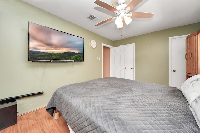 14518 Littleford St, Houston, TX 77045 - bedroom featuring wood finished floors, ceiling fan, and baseboards