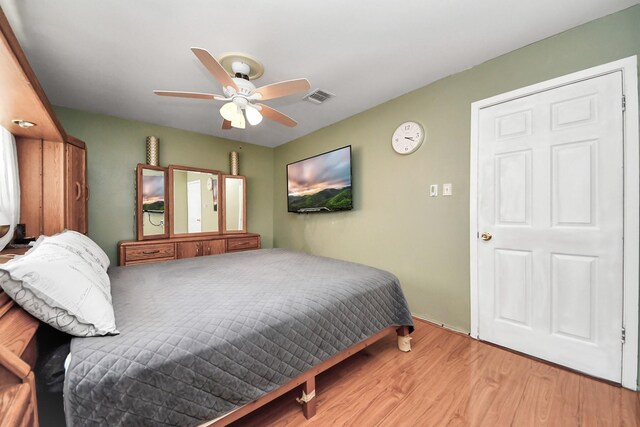 14518 Littleford St, Houston, TX 77045 - bedroom featuring wood finished floors and ceiling fan