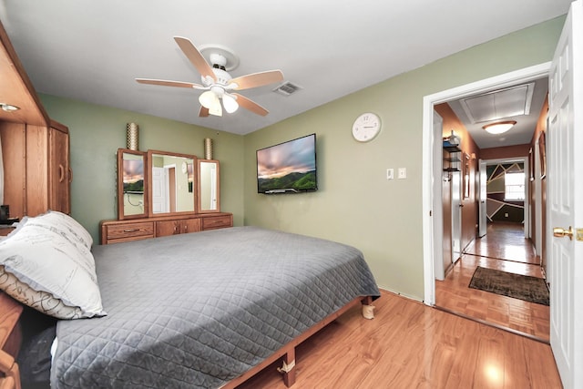 14518 Littleford St, Houston, TX 77045 - bedroom featuring attic access, wood finished floors, and ceiling fan