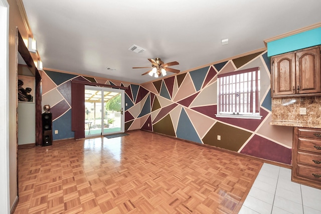 14518 Littleford St, Houston, TX 77045 - spare room with baseboards, a ceiling fan, wallpapered walls, and an accent wall