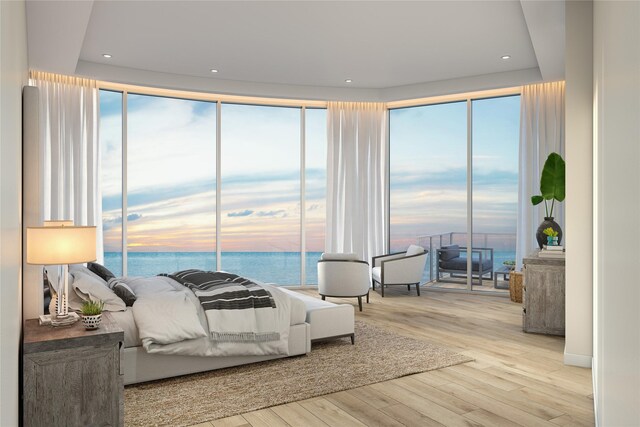 10525 San Luis Pass Rd Unit 401, Galveston, TX 77554 - bedroom featuring a water view, wood finished floors, and recessed lighting