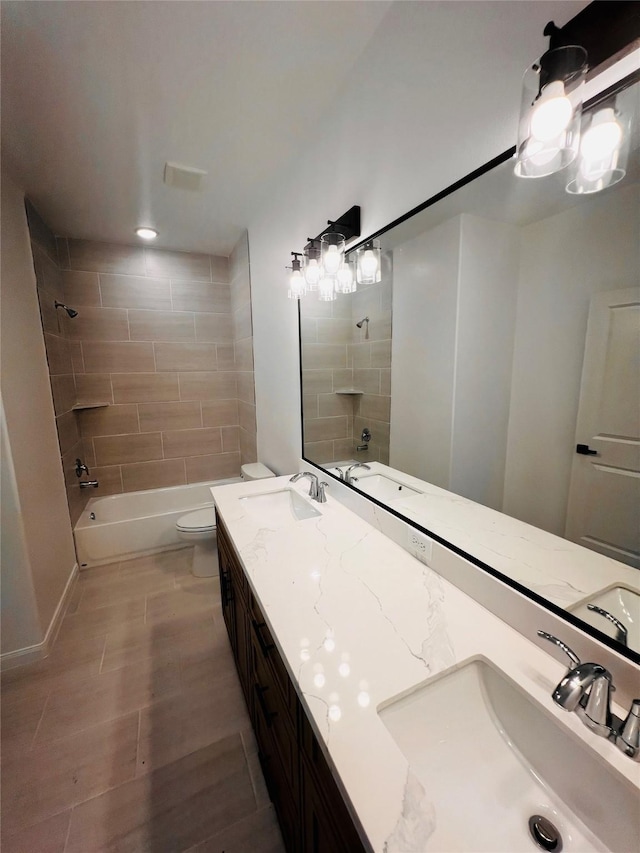 7931 Fields St, Houston, TX 77028 - bathroom with double vanity, bathtub / shower combination, toilet, and wood finished floors