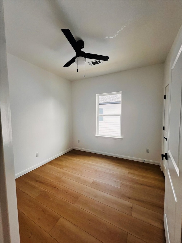 7931 Fields St, Houston, TX 77028 - unfurnished room with hardwood / wood-style flooring, ceiling fan, and baseboards