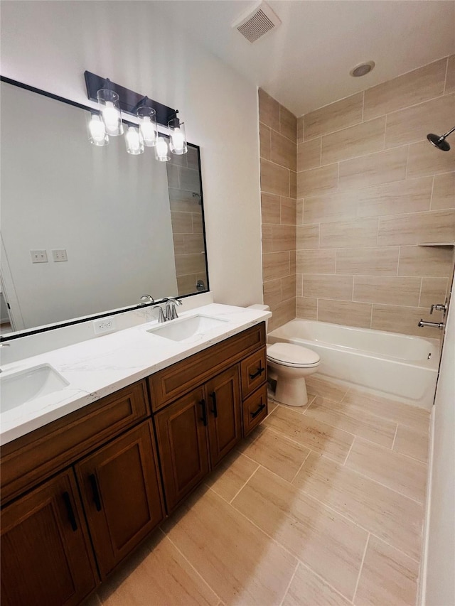 7931 Fields St, Houston, TX 77028 - full bathroom with double vanity, toilet, and washtub / shower combination