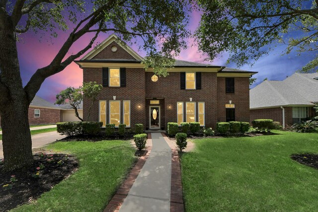 14011 Blazey Dr, Houston, TX 77095 - georgian-style home featuring a lawn and brick siding