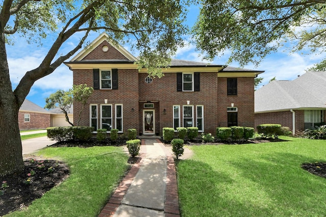 14011 Blazey Dr, Houston, TX 77095 - view of front of house featuring a front yard and brick siding