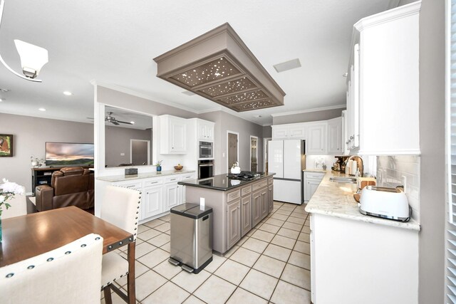 14011 Blazey Dr, Houston, TX 77095 - kitchen with freestanding refrigerator, light tile patterned floors, a ceiling fan, white cabinets, and recessed lighting