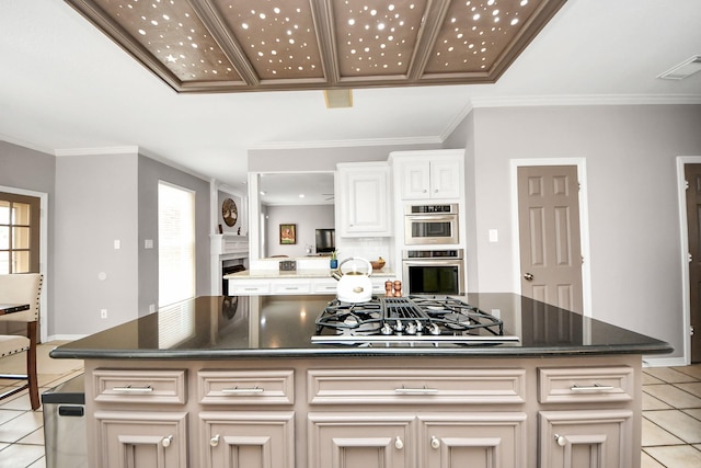 14011 Blazey Dr, Houston, TX 77095 - kitchen featuring light tile patterned flooring, stovetop with downdraft, stainless steel double oven, baseboards, and a kitchen island