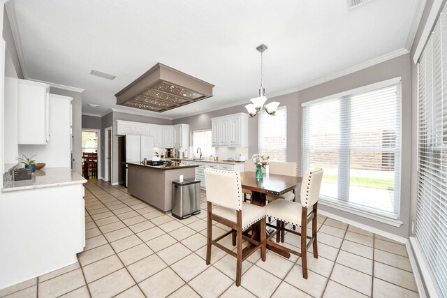 14011 Blazey Dr, Houston, TX 77095 - dining space with light tile patterned flooring, a chandelier, crown molding, and baseboards