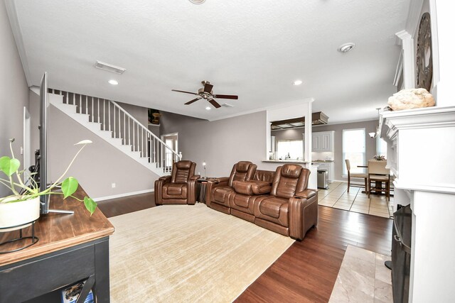 14011 Blazey Dr, Houston, TX 77095 - living area with ceiling fan, stairs, wood finished floors, recessed lighting, and baseboards