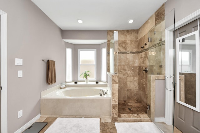 14011 Blazey Dr, Houston, TX 77095 - full bathroom with a shower stall, a jetted tub, and baseboards