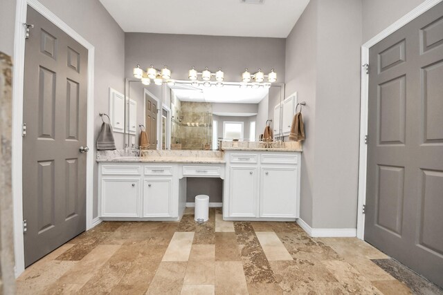 14011 Blazey Dr, Houston, TX 77095 - full bath featuring a stall shower, two vanities, baseboards, and stone finish floors